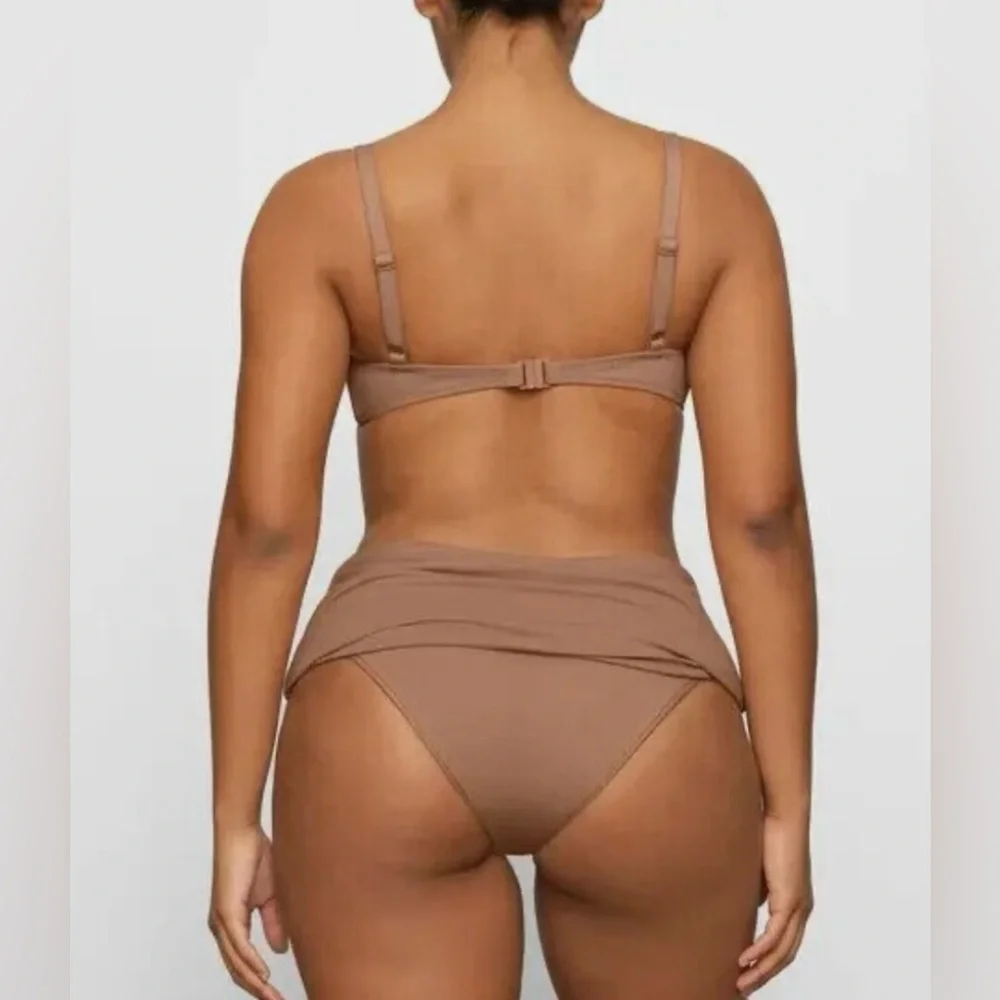 *7.  Skims Sculpting Ruched Swim Top